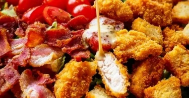 Crispy Chicken BLT Salad with fresh lettuce, tomatoes, bacon, and crispy chicken