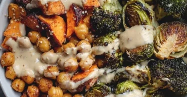 Delicious roasted chickpea and veggie bowl filled with colorful vegetables.