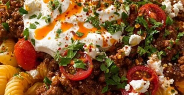 Plate of traditional Turkish pasta with rich sauces and spices
